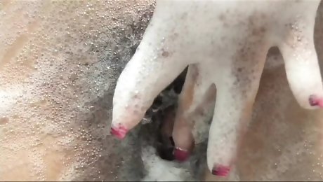 Andrea Kelly a slut with a hairy pussy stimulates her clit