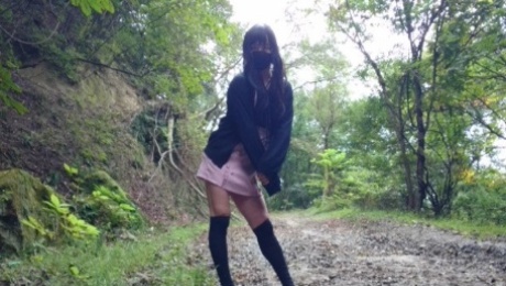 Cute little crossdresser masturbates and ejaculates in an untamed forest.